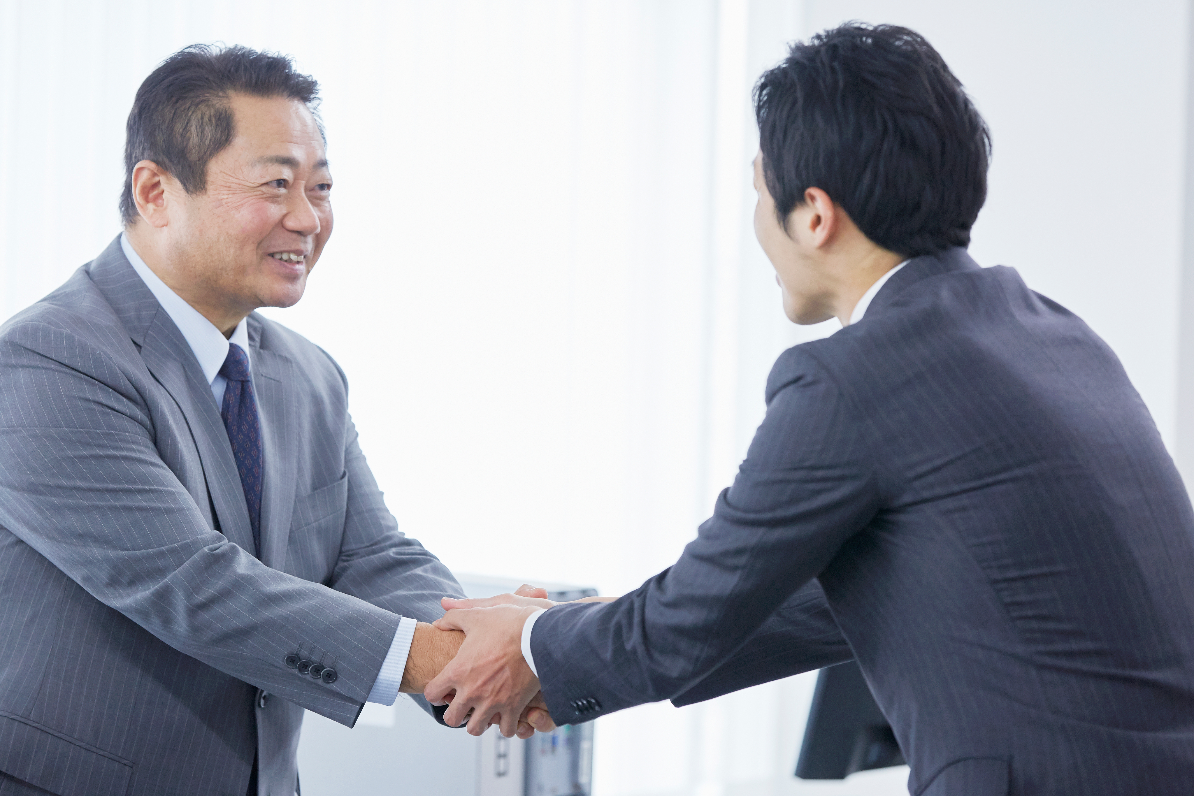 Photo of a study hall with wooden tables and chairs.
